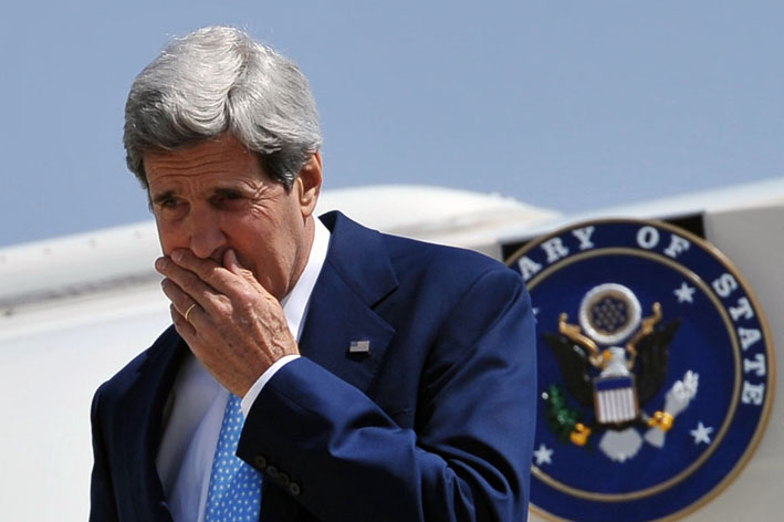 U.S. Secretary of State John Kerry steps off his plane upon his arrival at Queen Alia International Airport in Amman