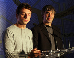 Google founders Larry Page (R) and Sergey Brin (L) speak at a press conference announcing Google's launch of a new transit mapping feature of Google Maps with the Metropolitan Transit Authority at Grand Central Station on September 23, 2008 in New York City.  