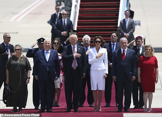 US President Donald Trump and his wife Melania, center, stand in attention during welcome ceremony accompany by the Israeli President Rueben Rivlin and his wife Nechama, on the left, and Prime Minister Benjamin Netanyahu and his wife Sarah in Tel Aviv, Monday, May 22,2017. (AP Photo/Oded Balilty)