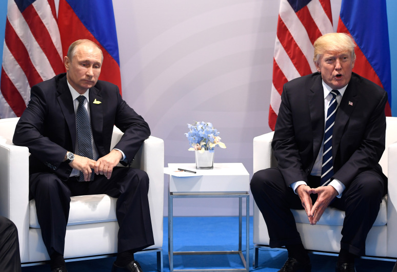 US President Donald Trump and Russia's President Vladimir Putin hold a meeting on the sidelines of the G20 Summit in Hamburg, Germany, on July 7, 2017. / AFP PHOTO / SAUL LOEB        (Photo credit should read SAUL LOEB/AFP/Getty Images)