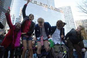 Activists gather across from Trump Tower before pulling down their pants and mooning on February 12, 2017 in Chicago, Illinois. The event was staged to protest the policies of President Donald Trump and to demand that he release his tax information. (Photo by Patrick Gorski/NurPhoto via Getty Images)