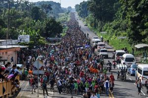 Honduran migrants take part in a caravan heading to the US, on the road linking Ciudad Hidalgo and Tapachula, Chiapas state, Mexico, on October 21, 2018. - Thousands of Honduran migrants resumed their march toward the United States on Sunday from the southern Mexican city of Ciudad Hidalgo, AFP journalists at the scene said. (Photo by Pedro Pardo / AFP)        (Photo credit should read PEDRO PARDO/AFP/Getty Images)