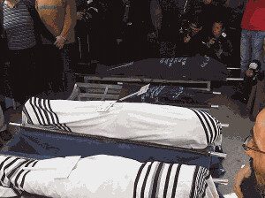 Bodies_wrapped_in_tallit_at_funeral_in_Givat_Shaul_(Fogel_family)