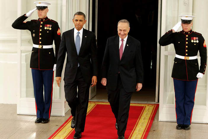 U.S. President Barack Obama (L) departs the White House with Senator Chuck Schumer (D-NY) in Washington January 21, 2013, enroute The U.S. Capitol for his ceremonial swearing-in for his second term. Schumer is the Chair of the Joint Congressional Committee on Inaugural Ceremonies.  REUTERS/Chris Kleponis (UNITED STATES - Tags: POLITICS)