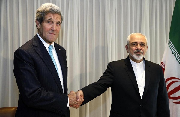 U.S. Secretary of State John Kerry shakes hands with Iranian Foreign Minister Mohammad Javad Zarif before a meeting in Geneva January 14, 2015.  REUTERS/Rick Wilking