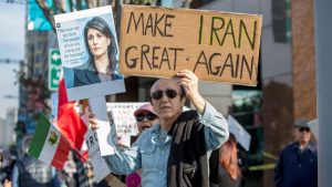 FILE PHOTO: People rally in support of Iranian anti-government protests in Los Angeles, California, U.S. January 7, 2018.  REUTERS/Monica Almeida/File Photo - RC1106F61E20