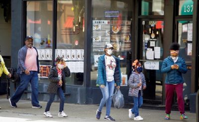 People walk along 53rd Street during the global outbreak of coronavirus disease (COVID-19) in Chicago, Illinois, U.S. April 7, 2020. REUTERS/Joshua Lott