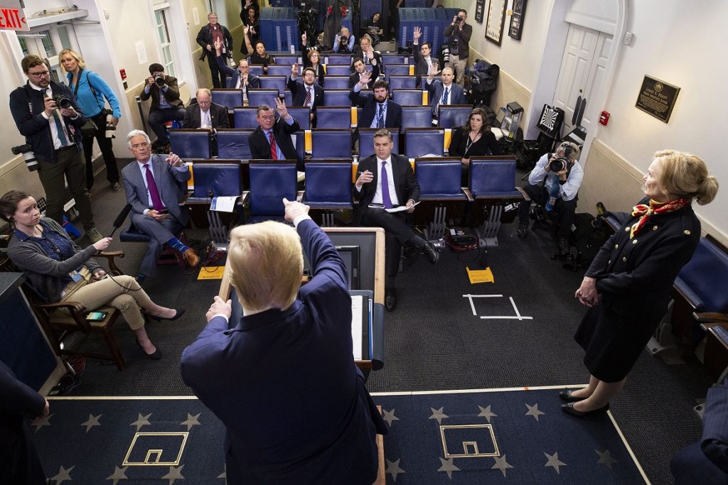 President Donald Trump points to a reporter to ask a question as he speaks about the coronavirus, with Dr. Deborah Birx, White House coronavirus response coordinator, at right, in the James Brady Press Briefing Room of the White House, Tuesday, March 31, 2020, in Washington. (AP Photo/Alex Brandon)