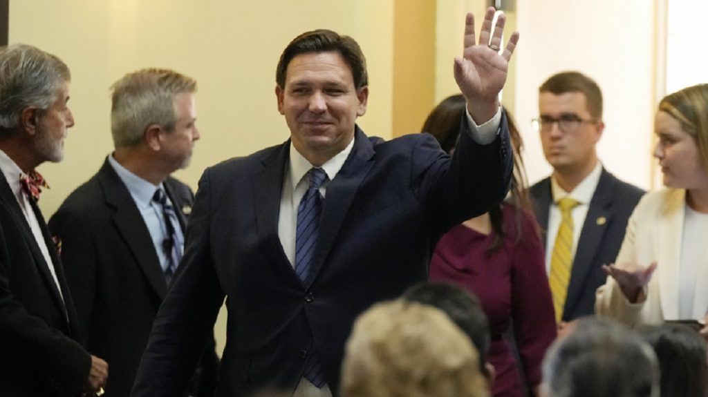 Florida Gov. Ron DeSantis waves as he arrives for a press conference to announce expanded toll relief for Florida commuters, Wednesday, Sept. 7, 2022, in Miami, Fla. (AP Photo/Rebecca Blackwell)